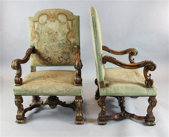A pair of 19th century French Restauration style parcel gilt and carved beech armchairs, W.2ft 5in. D.2ft 3in. H.4ft 1in.